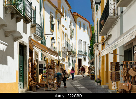 Portugal, the Alentejo, Évora, a narrow street lined with handicraft shops Stock Photo
