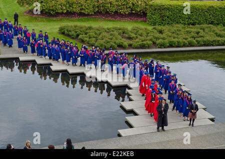 Simon Fraser University  graduands by the reflecting pond in the Academic Quadrangle before the Spring 2014 convocation ceremony for the Faculty of Arts and Social Sciences.  Credit: Maria Janicki/Alamy Stock Photo
