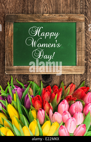 vintage green chalkboard with tulip flowers and sample text Happy Women's Day! Stock Photo