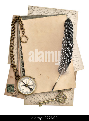 vintage papers and postcards isolated on white background. antique feather pen and compass. journey concept Stock Photo