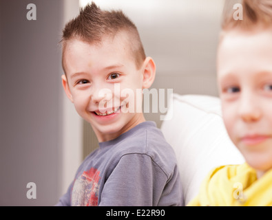 two little boys having lots of fun with video games Stock Photo