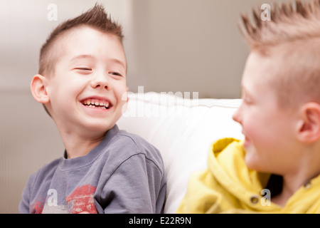 two little boys having lots of fun with video games Stock Photo