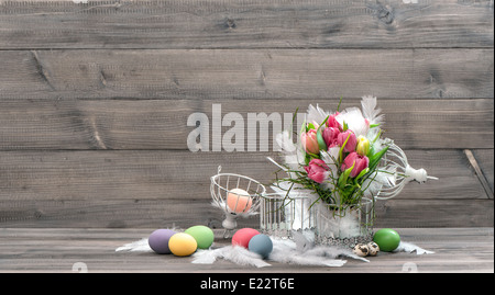 tulip flowers with easter eggs. vintage home decoration. retro style toned picture Stock Photo