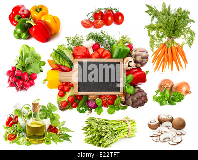 Set of variety fresh herbs and vegetables and isolated on white background. Blackboard for your text and recipes. Stock Photo