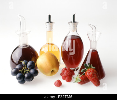Four fruit vinegars Stock Photo
