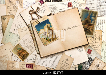 old postcards, letters, mails and open journal with sample text My Travel Book. vintage style travel background Stock Photo