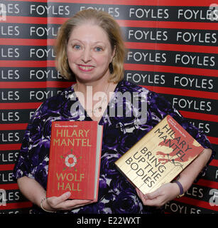 London, UK. 13th June 2014 Dame Hilary Mantel, double Man Booker prize winner holding Wolf Hall and Bring up The bodies at opening of the new Foyles bookshop in London Credit:  Prixnews/Alamy Live News Stock Photo