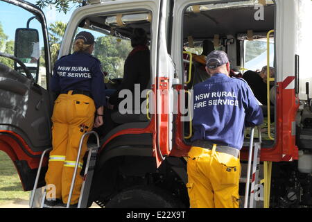 Sydney, Australia. 14th June 2014. New South Wales Rural Fire Service volunteer firefighters attend a military tattoo event in Sydney,NSW,Australia, pictured beside their rural fire service truck Stock Photo