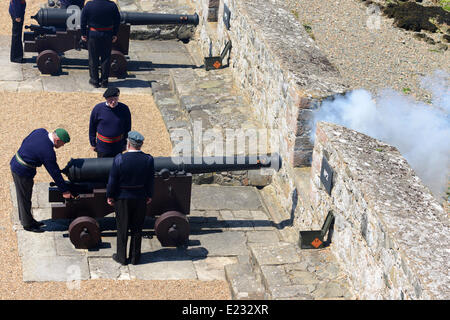 Castle Cornet, St. Peter Port, Guernsey, Channel Islands. 14th June 2014. A 21 gun salute at Noon marks the official birthday of the Queen. The guns are manned by volunteer crews and the local Combined Cadet Force mount a guard of honour.  Guernsey is a Crown Dependency of the British Crown and every year it opens all its museums to the public for free to mark the occasion. Credit:  Robert Smith/Alamy Live News Stock Photo