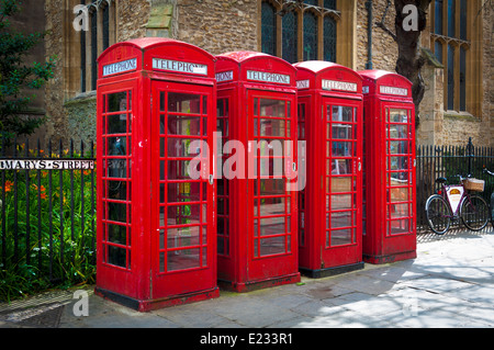 Row of red British telecom telephone boxes, England, UK Stock Photo