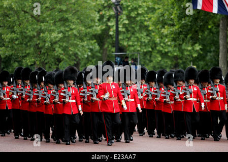 London, UK. 14th June, 2014. Members of the Queen's Guards march during Trooping the Colour in London on June 14, 2014. The ceremony of Trooping the Colour is to celebrate the Sovereign's offical birthday. Credit:  Bimal Gautam/Xinhua/Alamy Live News Stock Photo