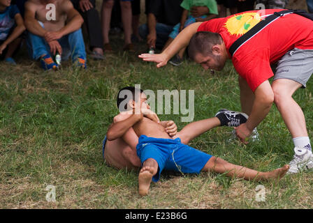 Razdel Yambol region Bulgaria Eastern Europe June 14th  2014:  Dry Wrestling has been practiced since the Thracian times, teenagers and young children sign on for the bye annual competition in a Strandja mountain village  held on the village green. Bulgarians of all ages are managing to preserve the dry wrestling style and keep a culture sport alive. Credit: Clifford Norton/Alamy Live News Stock Photo