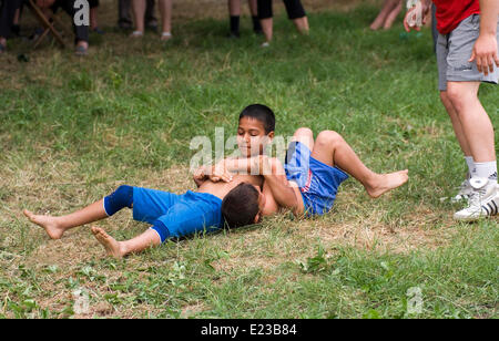 Razdel Yambol region Bulgaria Eastern Europe June 14th  2014:  Dry Wrestling has been practiced since the Thracian times, teenagers and young children sign on for the bye annual competition in a Strandja mountain village  held on the village green. Bulgarians of all ages are managing to preserve the dry wrestling style and keep a culture sport alive. Credit: Clifford Norton/Alamy Live News Stock Photo