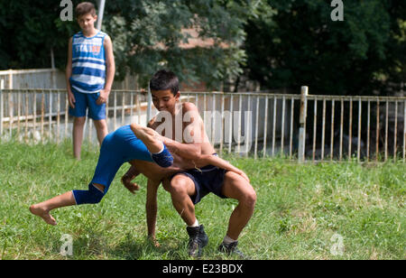 Razdel Yambol region Bulgaria Eastern Europe June 14th  2014:  Dry Wrestling has been practiced since the Thracian times, teenagers and young children sign on for the bye annual competition in a Strandja mountain village  held on the village green. Bulgarians of all ages are managing to preserve the dry wrestling style and keep a culture sport alive. Credit: Clifford Norton/Alamy Live News Stock Photo