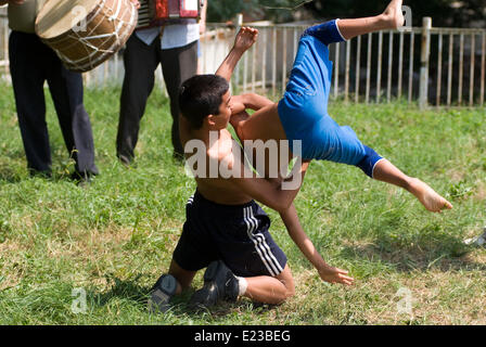 Razdel Yambol region Bulgaria Eastern Europe June 14th  2014:  Dry Wrestling has been practiced since the Thracian times, teenagers and young children sign on for the bye annual competition in a Strandja mountain village  held on the village green. Bulgarians of all ages are managing to preserve the dry wrestling style and keep a culture sport alive. Credit: Clifford Norton/Alamy Live News Stock Photo