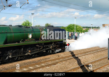 Retford, North Nottinghamshire, UK. 14th June, 2014. Steam engine 34046 Braunton takes on water at Retford station on route from York to London . Credit:  Ian Francis/Alamy Live News Stock Photo