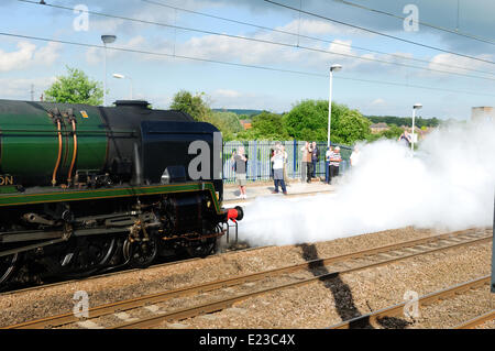 Retford, North Nottinghamshire, UK. 14th June, 2014. Steam engine 34046 Braunton takes on water at Retford station on route from York to London . Credit:  Ian Francis/Alamy Live News Stock Photo