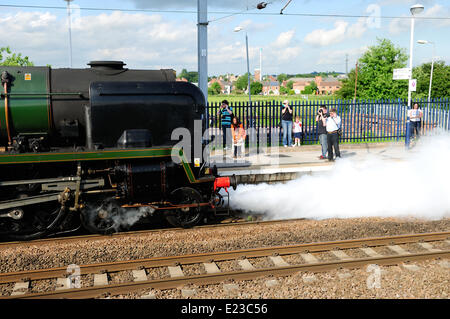 Retford, North Nottinghamshire, UK. 14th June, 2014. Steam engine 34046 Braunton takes on water at Retford station on route from York to London . Credit:  Ian Francis/Alamy Live News Stock Photo