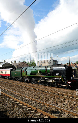 Retford, North Nottinghamshire, UK. 14th June, 2014. Steam engine 34046 Braunton takes on water at Retford station on route from York to London . Credit:  Ian Francis/Alamy Live News