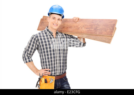 Construction worker holding a couple of planks Stock Photo