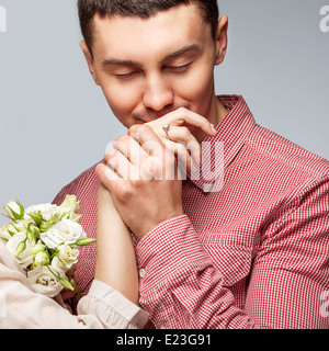 man kissing a woman's hand Stock Photo