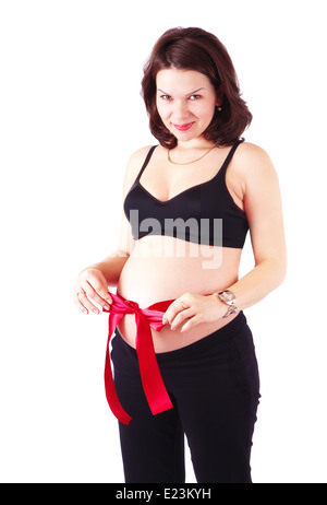 Beautiful pregnant woman with red ribbon Stock Photo