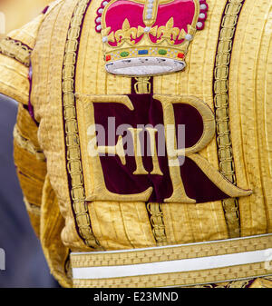 London, Britain. 14th June, 2014. A crown and the cypher EIIR (which stands for: Elizabeth II Regina) decorates the back of the uniform of a Queen's trooper who is making his way to Buckingham Palace during the Trooping of the Colour annual birthday parade in London, Britain, 14 June 2014. Photo: Albert Nieboer -/dpa/Alamy Live News Stock Photo