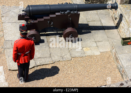 Ceremony on Castle Cornet, St Peter Port, Guernsey. Firing of the noon gun or canon Stock Photo