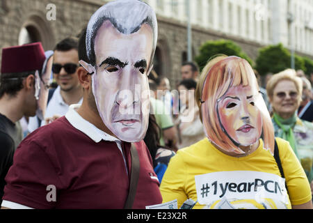 Sofia, Bulgaria. 14th June, 2014. Thousands joined the protest ''DANS no more'' before the National Assembly in Sofia to mark one year since anti-government demonstrations have began in the capital and other Bulgarian cities. The protests started on June 14, 2013 when Delian Peevski was elected President of the State Agency for National Security (DANS) by the Parliament. © Hristo Vladev/NurPhoto/ZUMAPRESS.com/Alamy Live News Stock Photo