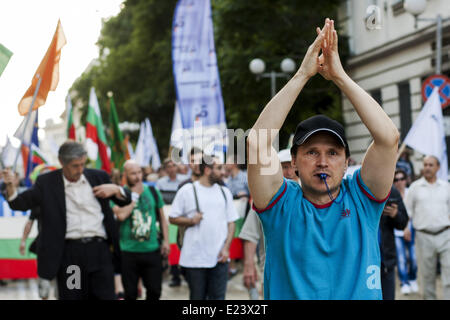 Sofia, Bulgaria. 14th June, 2014. Thousands joined the protest ''DANS no more'' before the National Assembly in Sofia to mark one year since anti-government demonstrations have began in the capital and other Bulgarian cities. The protests started on June 14, 2013 when Delian Peevski was elected President of the State Agency for National Security (DANS) by the Parliament. © Hristo Vladev/NurPhoto/ZUMAPRESS.com/Alamy Live News Stock Photo