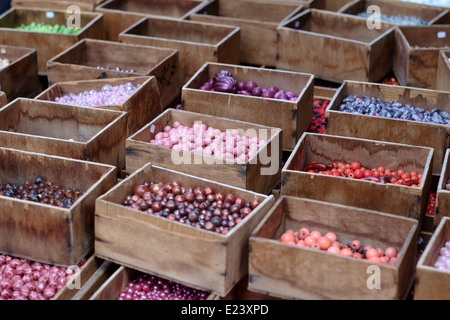 Paris fleamarket,  Les Puces de Saint-Ouen, showing colored beads in wooden boxes Stock Photo