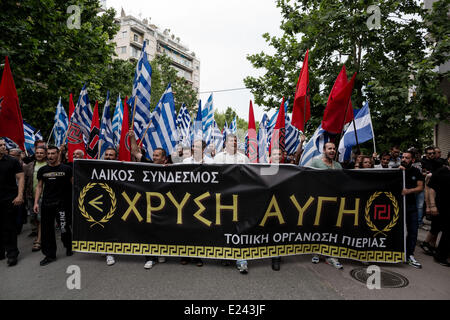 Thessaloniki, Greece. 15th June, 2014. Golden Dawn supporters shout slogans as marching after a demonstration in memory of Alexander the Great in Thessaloniki, Greece. Extreme right-wing Golden Dawn party organize a Honorary Event for Alexander the Great at the northern port city of Thessaloniki Greece. Golden Dawn, won nearly 9.39 percent of the vote in May 25 elections and 3 seats in the European parliament. Credit:  Konstantinos Tsakalidis/Alamy Live News Stock Photo