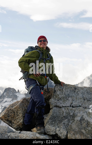 A lady climber on the summit of the Aiguille de Tour in the French Alps Stock Photo