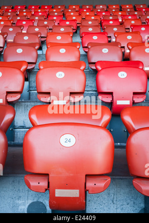 Empty seats on a football stadium's grandstand Stock Photo