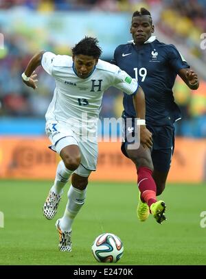 Porto Alegre, Brazil. 15th June, 2014. Frances Paul Pogba (R) strives for the ball controlled by Honduras Carlo Costly during a Group E match between France and Honduras of 2014 FIFA World Cup at the Estadio Beira-Rio Stadium in Porto Alegre, Brazil, June 15, 2014. (Xinhua/Li Ga)(pcy) (SP)BRAZIL-PORTO ALEGRE-WORLD CUP 2014-GROUP E-FRANCE VS HONDURAS Credit:  Action Plus Sports/Alamy Live News Stock Photo