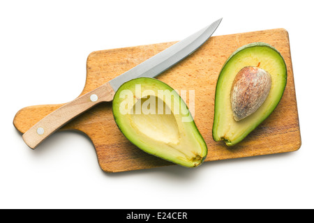 the halved avocados on cutting board Stock Photo