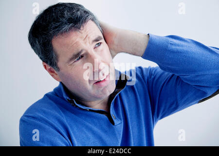 Ear pain in a man Stock Photo