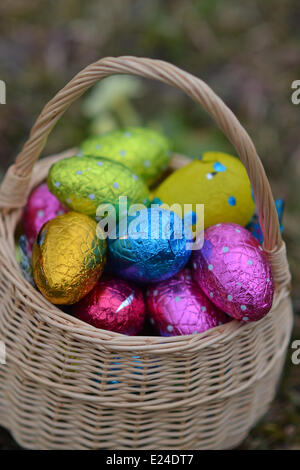 Colourful easter eggs in a basket. Stock Photo