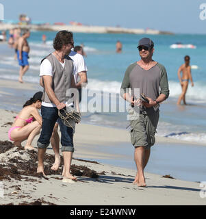 Gerard Butler enjoys a walk barefoot along Miami Beach accompanied by two male companions  Featuring: Gerard Butler Where: Miami Beach, Florida, United States When: 04 Feb 2013 Stock Photo