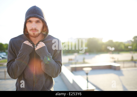 Portrait of young attractive sportsman looking at camera Stock Photo
