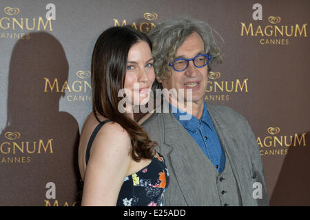 Liv Tyler and Wim Wenders posing at Magnum Ice-Cream's Beach during the 66th Cannes Film Festival  Featuring: Liv Tyler,Wim Wenders Where: Cannes, France When: 17 May 2013 Stock Photo