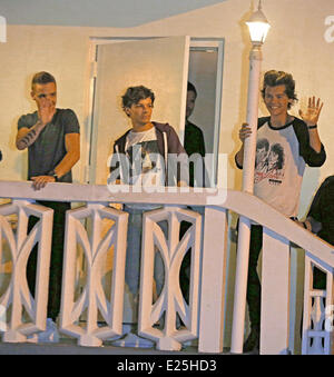 One Direction wave to fans on a balcony in Miami  Featuring: Liam Payne,Louis Tomlinson,Harry Styles,One Direction Where: Miami, Florida, United States When: 14 Jun 2013 Stock Photo