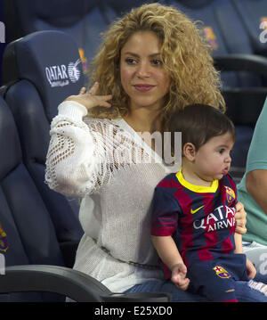 Shakira, along with her baby son and mother-in-law, watch her partner Gerard Pique in an FC Barcelona football match against Sevilla FC  Featuring: Shakira,Milan Pique Mebarak Where: Barcelona, Spain When: 14 Sep 2013 Stock Photo