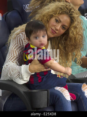 Shakira, along with her baby son and mother-in-law, watch her partner Gerard Pique in an FC Barcelona football match against Sevilla FC  Featuring: Shakira,Milan Pique Mebarak Where: Barcelona, Spain When: 14 Sep 2013 Stock Photo