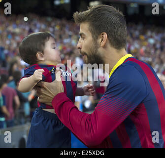 Shakira, along with her baby son and mother-in-law, watch her partner Gerard Pique in an FC Barcelona football match against Sevilla FC  Featuring: Milan Pique Mebarak,Gerard Pique Where: Barcelona, Spain When: 14 Sep 2013 Stock Photo