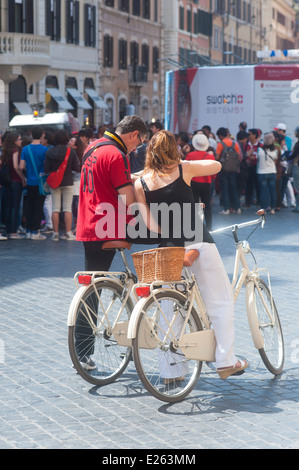 Rome Italy 2014 - Couple tourists on bicycle looking at map Stock Photo
