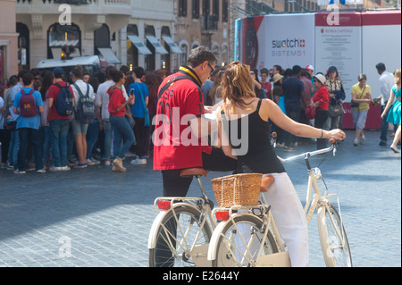 Rome Italy 2014 - Couple tourists on bicycle looking at map Stock Photo