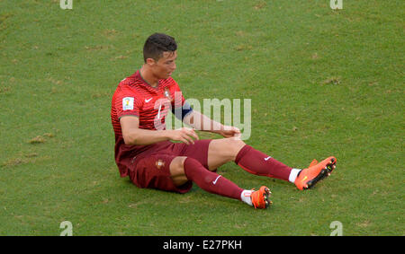 Salvador da Bahia, Brazil. 16th June, 2014. Salvador da Bahia, Brazil.  16th June, 2014. Salvador, Brazil. 16th June, 2014. Portugal's Cristiano Ronaldo sits on the pitch during the FIFA World Cup 2014 group G preliminary round match between Germany and Portugal at the Arena Fonte Nova in Salvador, Brazil, 16 June 2014. Photo: Thomas Eisenhuth/dpa/Alamy Live News Credit:  dpa picture alliance/Alamy Live News Stock Photo