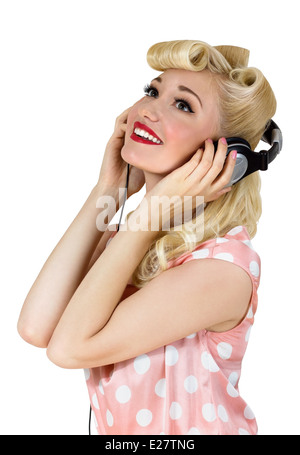 Portrait of beautiful blonde girl listening to music. Retro pin-up style Stock Photo