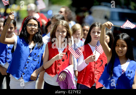 New York, USA. 16th June, 2014. People attend the Flag Day parade in Manhattan, New York City, the United States, on June 16, 2014. The Flag Day is celebrated every year to commemorate the adoption of the flag of the United States in 1777. Credit:  Wang Lei/Xinhua/Alamy Live News Stock Photo